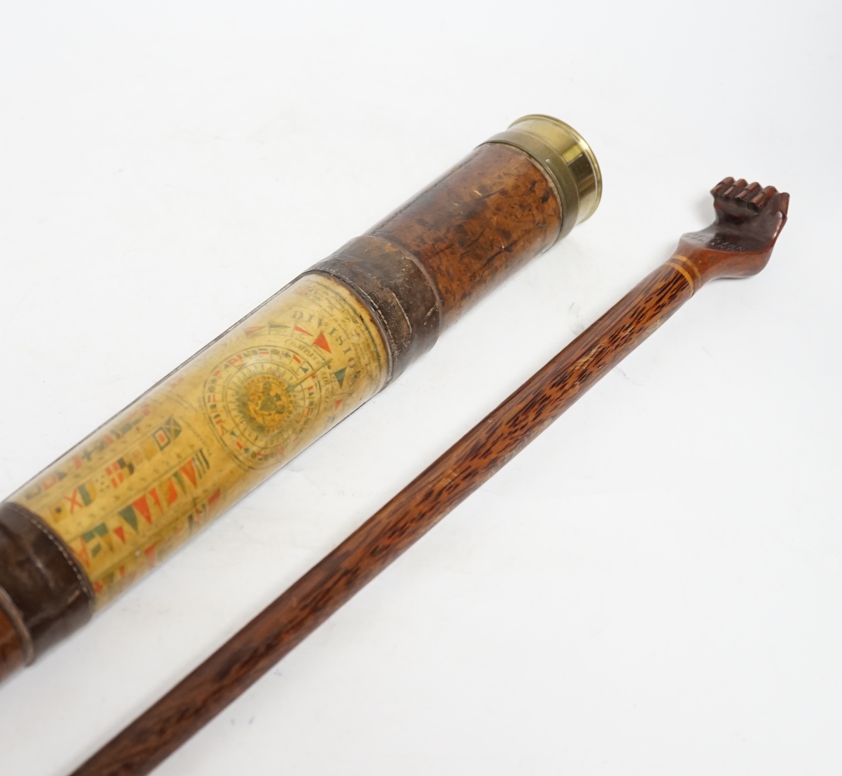 An inscribed cocus wood walking stick with carved handle in the form of a hand, ‘Pitcairn Island’ and a brass mounted two drawer telescope, largest 92cm in length